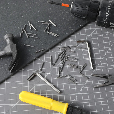 Spring Hinge Tension Pin Replacement Kit With 40 Stainless Steel Shelf Pins And 2 Hex Wrenches on a work surface