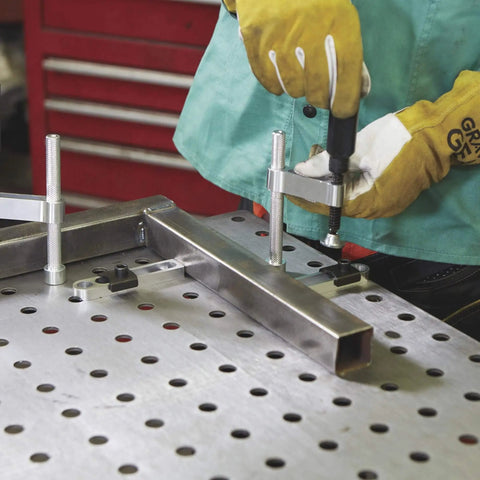 4 Piece Welding Table Clamp Kit With Lightweight Aluminum Frame And ABS Handle in use on 16mm hole table, easy setup and secure hold