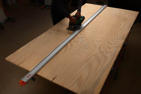 Person using NGX 96 Inch Clamp Edge System With Quick Connect And Quick Lock Lever For Fast, Accurate Straight Cuts On Circular Saws
