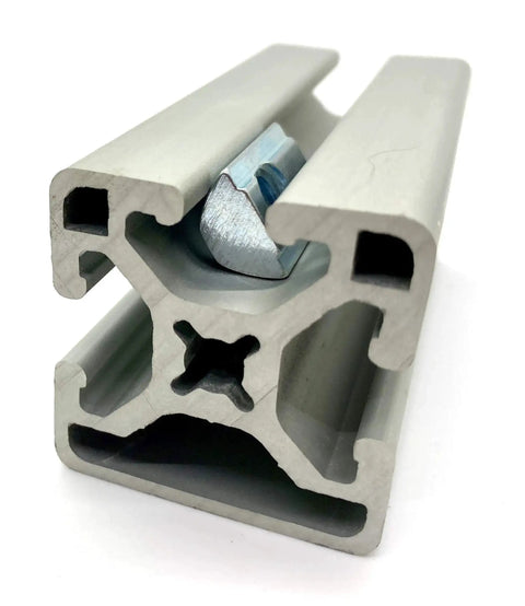 Roll-In T-Nut With Ball Spring 5/16-18, 24 Pack, installed in 15 Series aluminum extrusion 13040 profile, side view