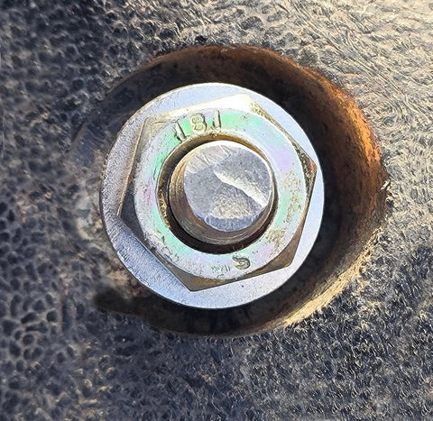 3/8 x 7/8 inch stainless flat washer (304 stainless) with bolt head visible