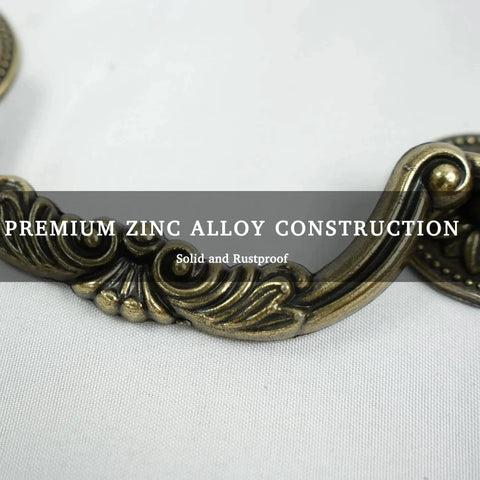 Close-up of Six Pack Antique Brass Drawer Pulls With Four And Three Quarters Inch Hole Centers, floral design, zinc alloy material