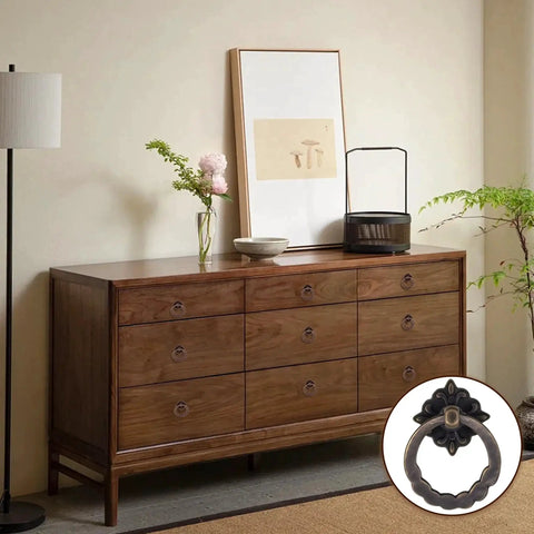 Wooden dresser with 10 Piece Set Retro Style Bronze Drop Ring Cabinet Pulls For Dresser And Antique Drawers shown close-up.