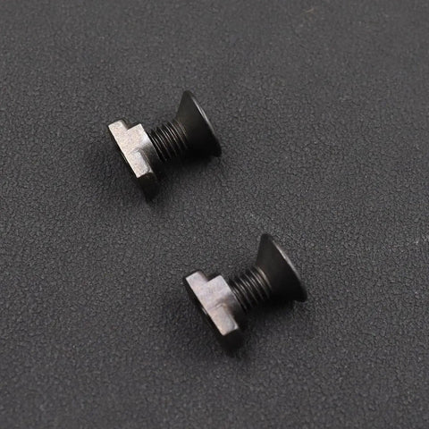 Close-up of two MLOK T Nuts and Screws Set M5 Steel for Rail Installations, showing threaded and anti-corrosion coated metal parts.