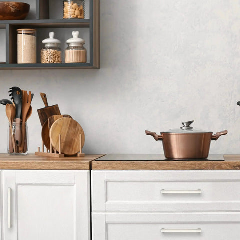 Modern kitchen with copper pot and Ten Pack Six And A Quarter Inch Square Kitchen Cabinet Handles in Satin Nickel Finish on white cupboards.