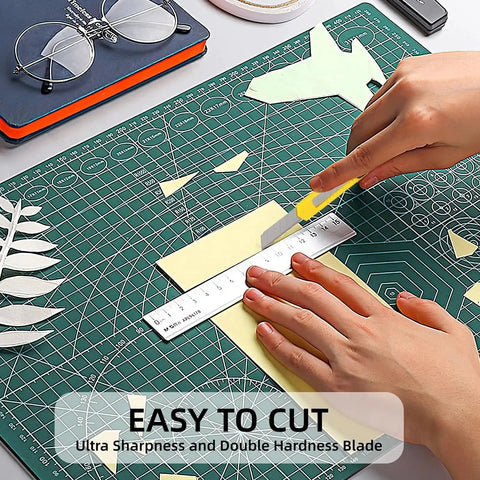 Person using yellow blade from 4 Pack Retractable Box Cutters Knife Set for Cardboard and Paper on cutting mat with ruler