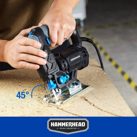 Powerful 4.8 Amp Jig Saw For Woodworking With Three Quarters Inch Stroke Includes Two Wood Cutting Blades Variable Speed Control And Four Stage Orbital Function With Brake For Smooth Precise DIY Wood Cutting By Hammerhead HAJS048 in use at 45-degree angle on wood surface.