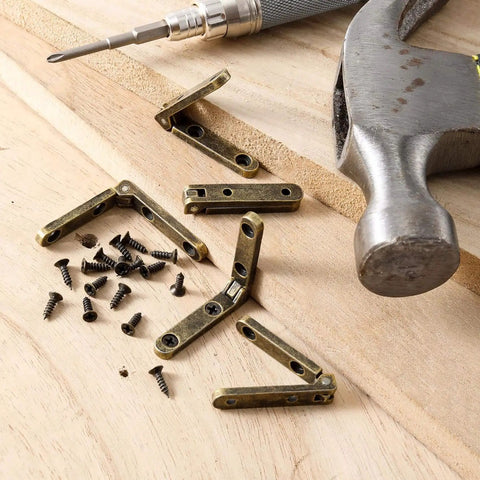 Six Pack 90 Degree Wooden Box Hinges With 24 Screws Bronze Finish alongside DIY tools on wooden surface.