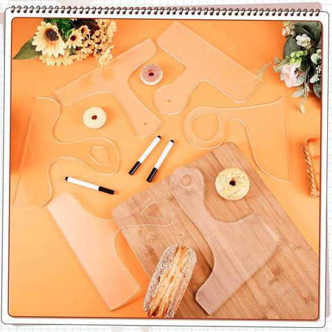 Six Piece Acrylic Router Template Set For Charcuterie Boards And Cutting Boards with three pens displayed on an orange surface