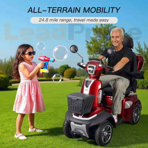 Man riding a heavy duty mobility scooter for seniors with 450 lb capacity, 500W motor, 12 mph top speed, in a park setting.