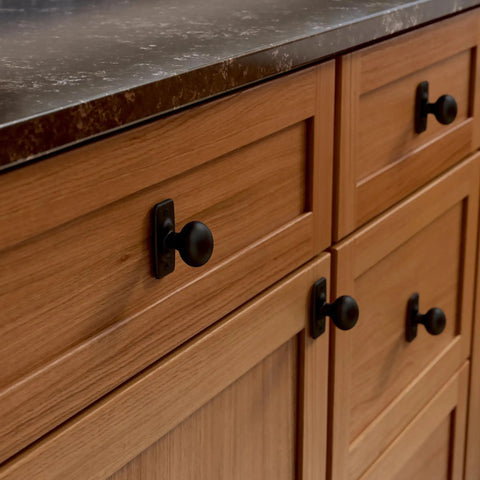 Matte Black Cabinet Knobs Set Five Pack One And One Quarter Inch Round For Dressers And Drawers Kitchen Cabinets Vanity Furniture And Closet Doors Durable Metal Hardware For Easy Weekend Update Franklin Brass installed on a wooden cabinet