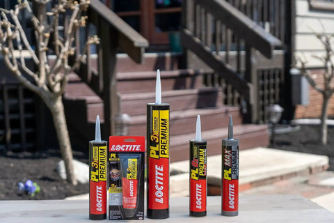 Loctite PL Premium and Tough As Nails Durable Polyurethane Construction Adhesive lined up on outdoor deck.
