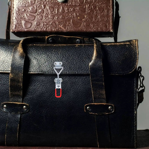 Eight Piece Adjustable Iron Toggle Latch Clamps With Quick Release installed on leather bag