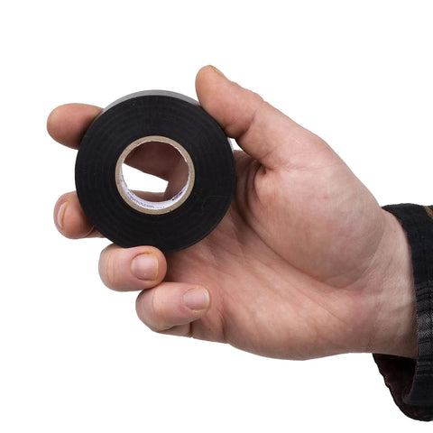 Person holding Economy Electrical Tape Three Quarter Inch Black Vinyl 60 Feet 7 Mil UL CSA