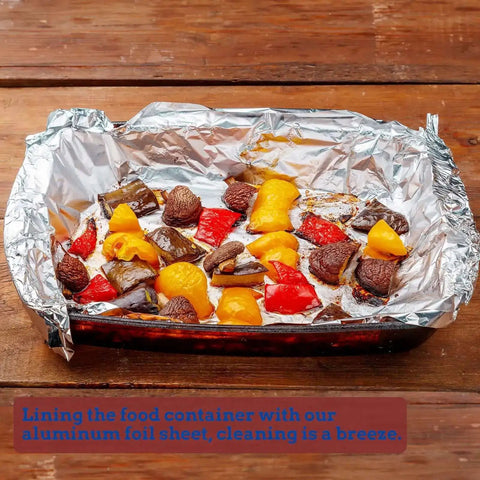 Heavy Duty Aluminum Foil Sheets 500 Pop Up Interfolded 12 By 12 Inch Sheets used in baking dish containing roasted vegetables