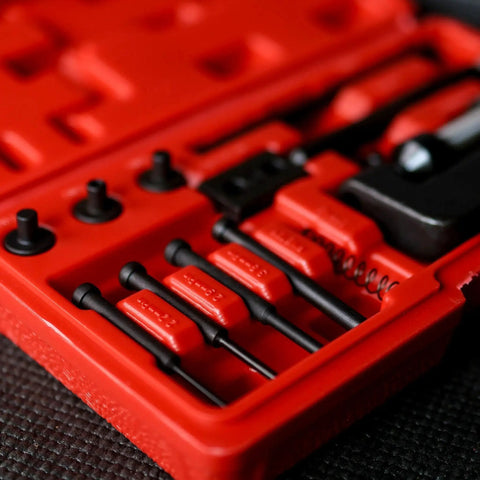 Close-up of Pro Grade Chain Breaker Tool Kit With Storage Case, showing tools and case interior details for motorcycle chains.