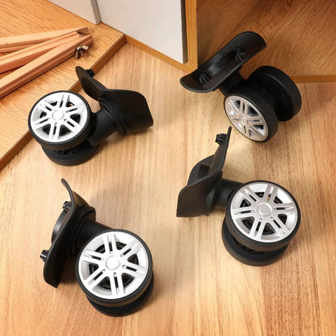 4 Pcs Universal Suitcase Wheel Replacement Set Heavy Duty Luggage Casters Quiet Dual Row Design Black shown on wood surface