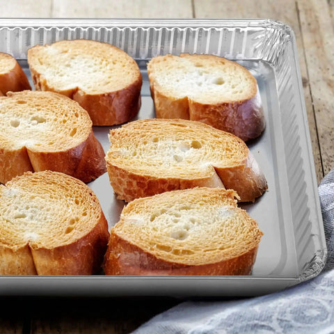 Slices of bread on Disposable Aluminum Pans 5 Pack 13 By 17 Baking Sheets Heavy Duty Cookie Sheets For Easy No Mess Cleanup And Reuse