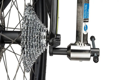 Derailleur Hanger Alignment Gauge DAG Two Point Two Pro Grade Bike Tool installed on bicycle with thru-axle setup.