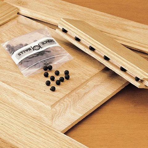 Wood Door And Panel Expansion Spacers 0.26 Inch Diameter with rubber balls preventing panel cracking shown on wooden panels