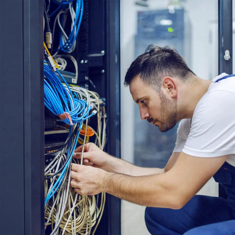 Technician installing Dope 500 Foot Cat6 Bulk Ethernet Cable 23 AWG CCA UTP Indoor Network Cable Gray for fast LAN setup