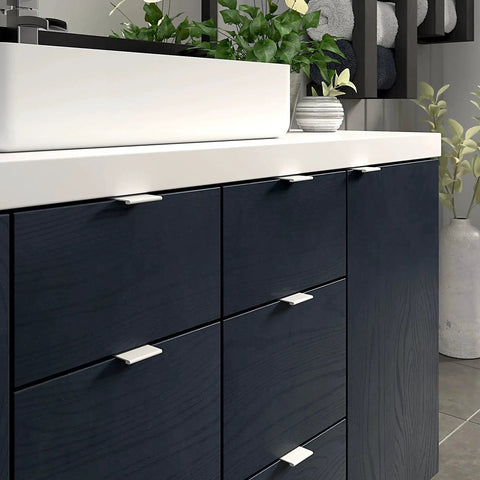 Lincoln Collection 1 5/16-Inch Center-To-Center White Modern Cabinet And Drawer Edge Pull Handle installed in a kitchen cabinet