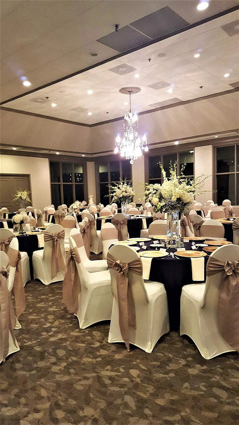 Banquet hall with chairs adorned with 10 Piece Satin Chair Sashes Bows For Wedding Reception And Banquet Decor Universal Back Tie For Chairs