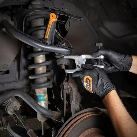 Adjustable Ball Joint Separator For Front Wheel Drive Cars And Light Trucks in use, separating joint in car suspension system.