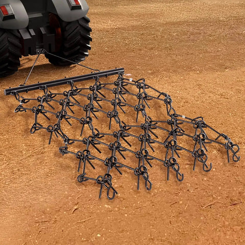 Heavy-Duty Chain Harrow with 69 Teeth attached to ATV. Drag Harrow For Tractor ATV And UTV Use Heavy Duty Chain Harrow With 69 Teeth 4 Ft By 4 Ft A True Workhorse For Soil Prep Seeding Lawn Smoothing Landscaping And Gravel Driveway Maintenance.