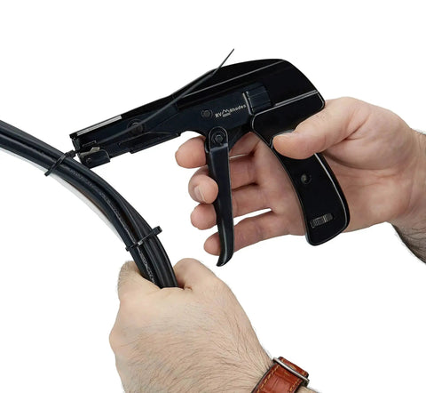 Hands using Zip Tie Gun And Cable Tie Install Tool With Adjustable Tension No Fuss Built In Cutter For Easy Cable Management Works With Nylon Ties Up To Quarter Inch Black on cables.