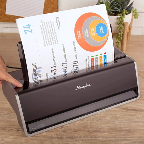Electric Three Hole Punch for 28 Sheet Capacity with Auto Jam Reverse and Touch Screen Control in use on desk