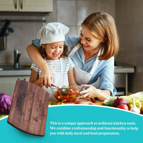 Mother and child cooking in kitchen with Custom Engraved Wooden Cutting Board Personalized For Weddings Anniversaries Birthdays And Mothers Day Gift In Maple Cherry Walnut Or Bamboo With Juice Grooves Handles And Available In Small Medium And Large Sizes For Home Chefs And Entertaining.