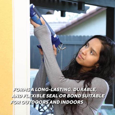 Rutland 500°F RTV high-heat silicone sealant applied with blue caulk gun outdoors by a woman.