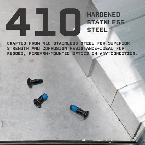 Close-up of Go To Red Dot Pistol Mount Screw Kit with three black stainless steel screws on metal surface
