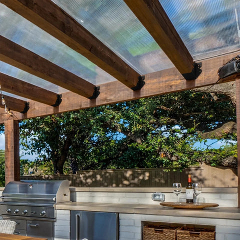 Outdoor kitchen with 24 Pcs 2x4 Joist Hangers Set Q235B Steel Black Powder Coated Face Mount Hurricane Ties on wooden pergola.