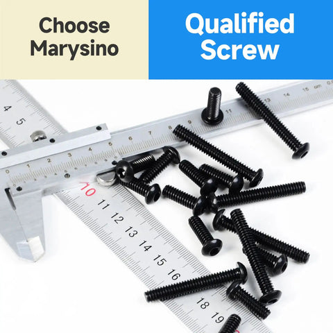 159 Piece M6 Screw Set With Button Head Socket Cap Screws Grade 10.9 Carbon Steel Black Oxide Finish scattered on a ruler