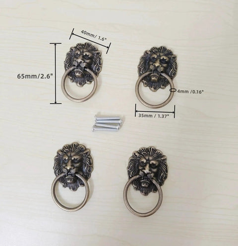 Antique Bronze Lion Head Ring Pull Cabinet Handles Set Of 4 With Screws, 2.6 Inches Long By 1.6 Inches Wide, displayed on table