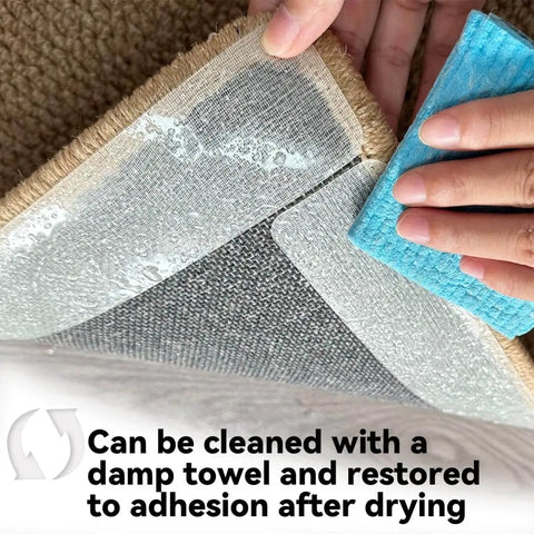 Person cleaning No Slip Rug Grippers Kit With 16 Large Double Sided Carpet Tape Strips, showing reuse and easy removal on area rugs.