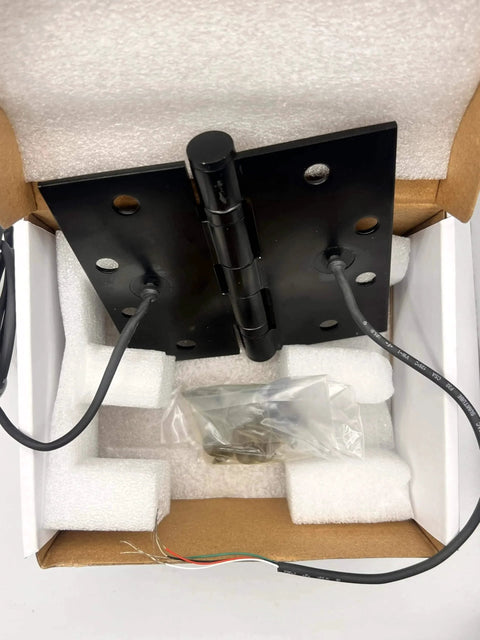 Electrified Steel Hinge Four Wire Electric Hinge Four And A Half Inches By Four And A Half Inches US26D Finish in packaging.