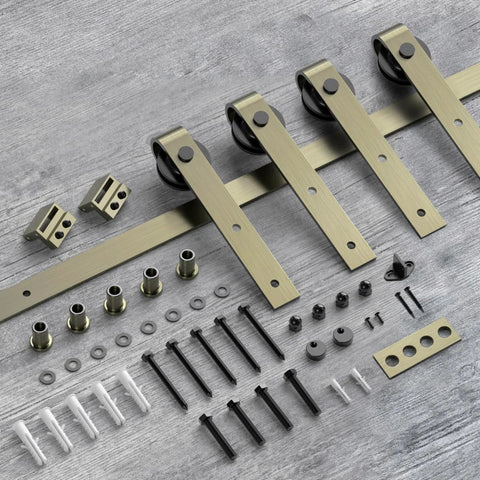 13 Foot Classic Brass Sliding Barn Door Hardware Kit For Interior Double Doors In Brushed Gold Finish Durable Carbon Steel Track With Smooth Rollers Supports Up To 200 Lbs DIY Friendly And Easy Assembly With Step By Step Guides laid out on a wooden surface