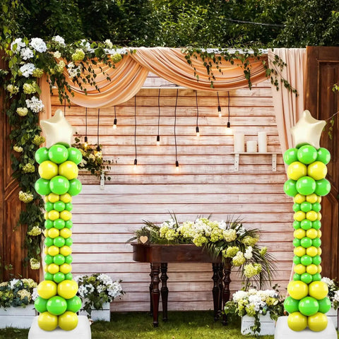 Adjustable Balloon Pillar Kit Set 4 With Stable Bases For Indoor Outdoor Events, two balloon towers with gold and green balloons.