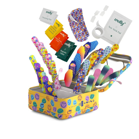 Colorful display of Welly Everyday First Aid Kit with Flexible Fabric Bandages That Move With You, Waterproof Tape, and Single Use Ointments.