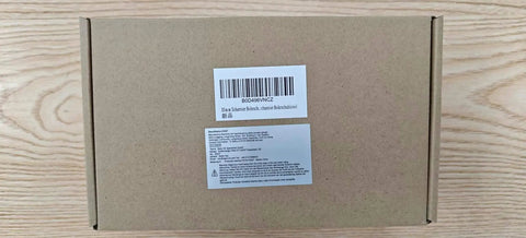 Cardboard box packaging for 35mm Concealed Hinge Jig, showing label and barcode on wooden background.