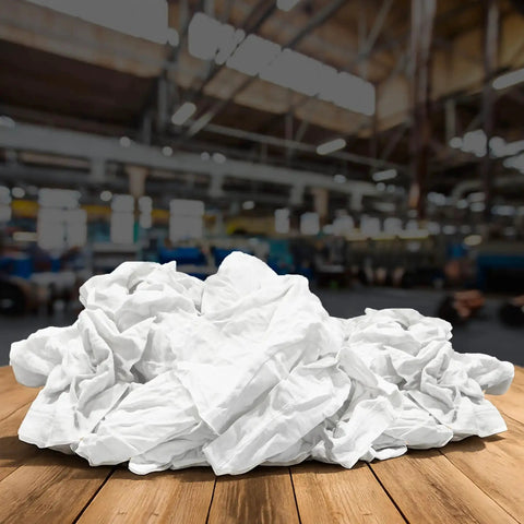 Bulk White Cotton Cleaning Rags Recycled T Shirt Rag Pack 5 Lb Compressed Box For Oil Grease Paint Stain Cleanup Auto Care Multipurpose Absorbent Garage Towels on wooden surface in an industrial setting