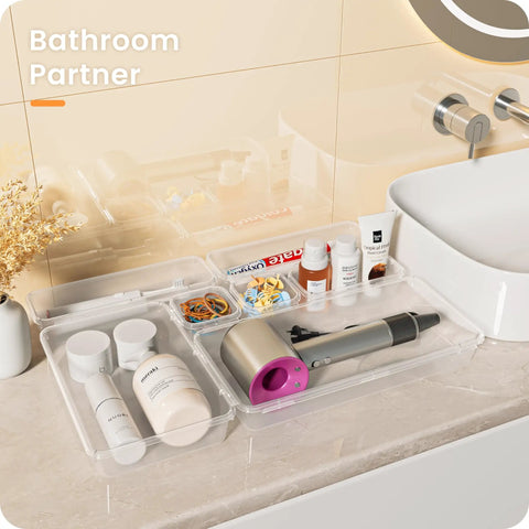 Military Grade Clear Drawer Organizer Set 28 Pcs 5 Sizes Holds 177 Items For Bathroom Vanity Desk Office Junk Drawer Pantry Storage By A LuGei on bathroom countertop with various toiletries.