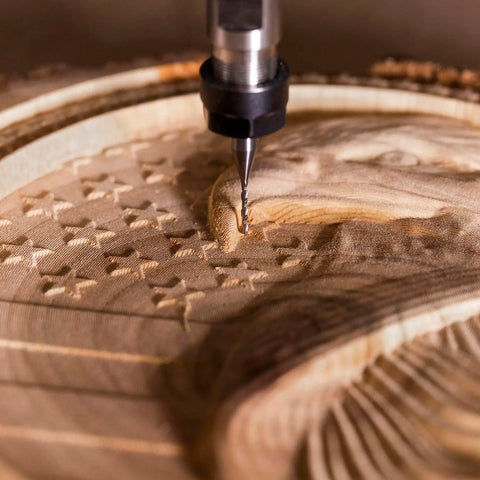 Down Cut Spiral Router Bit One Sixteenth Inch Cutting Diameter With One Quarter Inch Shank For Woodworking And CNC Routers Solid Carbide End Mill For Clean Grooves Mortises And Dados In Wood being used on detailed wood carving