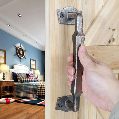 10 Inch Heavy Duty Rustic Sliding Barn Door Pull Handle In Oil Rubbed Bronze Finish on wooden door with hand gripping it