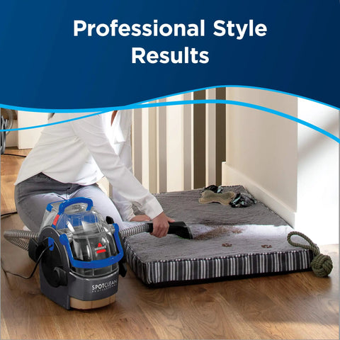 Pro Grade Portable Carpet And Upholstery Deep Cleaner For Stairs Rugs And Auto Interiors With 5.7A Motor 5ft Hose 3 In 1 Stair Tool Tough Stain Brush And Hydro Rinse Self Clean System BISSELL in use on a rug.