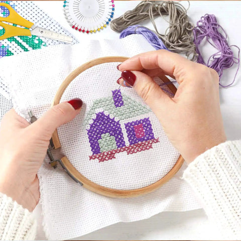 Hands embroidering with 304 Pack Embroidery Starter Kit With 200 Color Floss 5 Bamboo Embroidery Hoops 2 Aida Cloths Easy Instructions Bag And Cross Stitch Tools Set For Beginners And Adults