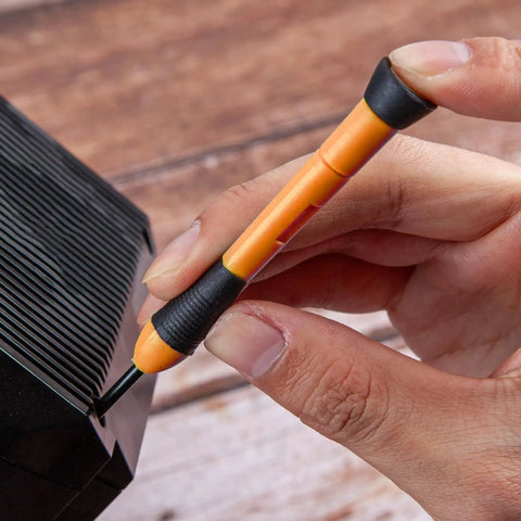 Close-up of orange screwdriver from 39 Piece Home Tool Set With Plastic Toolbox Storage Case Orange used on electronics.